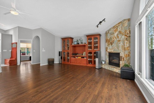 39 Highlands Terrace, Bragg Creek, AB - Indoor Photo Showing Living Room With Fireplace