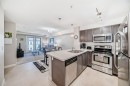313-2300 Evanston Square Nw, Calgary, AB  - Indoor Photo Showing Kitchen With Double Sink 