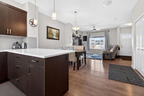 23 Belgian Link, Cochrane, AB - Indoor Photo Showing Kitchen With Upgraded Kitchen