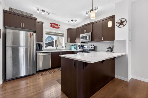 23 Belgian Link, Cochrane, AB - Indoor Photo Showing Kitchen With Upgraded Kitchen