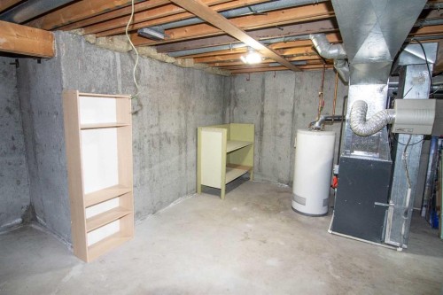 6-100 Pennsylvania Road Se, Calgary, AB - Indoor Photo Showing Basement