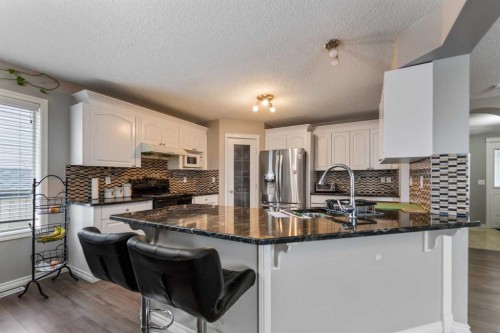 130 Invermere Drive, Chestermere, AB - Indoor Photo Showing Kitchen With Upgraded Kitchen