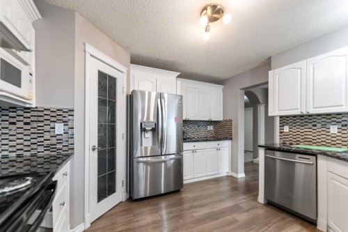 130 Invermere Drive, Chestermere, AB - Indoor Photo Showing Kitchen With Upgraded Kitchen