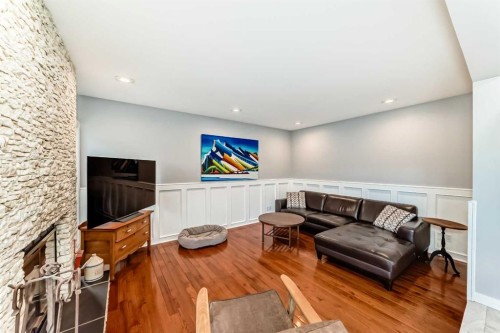 75 Sunmount Crescent Se, Calgary, AB - Indoor Photo Showing Other Room With Fireplace
