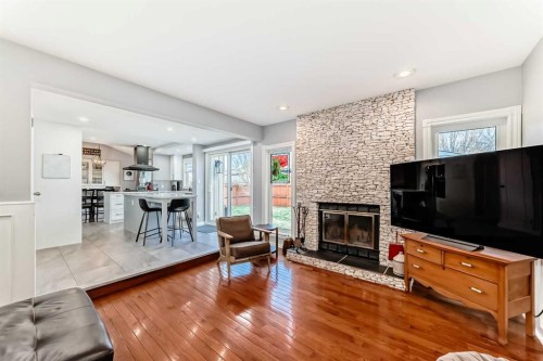 75 Sunmount Crescent Se, Calgary, AB - Indoor Photo Showing Living Room With Fireplace