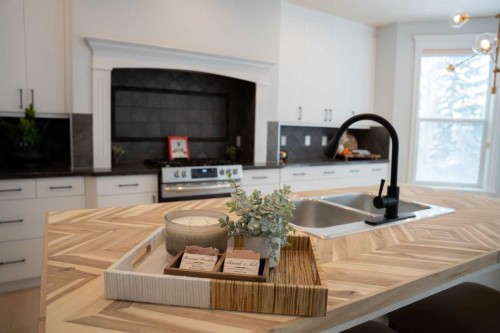 3 Strathridge Bay Sw, Calgary, AB - Indoor Photo Showing Kitchen With Double Sink
