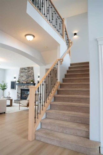 3 Strathridge Bay Sw, Calgary, AB - Indoor Photo Showing Other Room With Fireplace