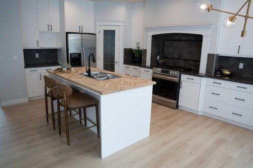 3 Strathridge Bay Sw, Calgary, AB - Indoor Photo Showing Kitchen With Double Sink