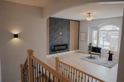 3 Strathridge Bay Sw, Calgary, AB - Indoor With Fireplace