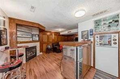 420 Whitehorn Place Ne, Calgary, AB - Indoor Photo Showing Other Room With Fireplace