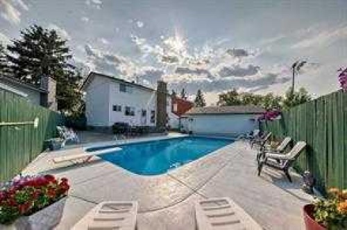 420 Whitehorn Place Ne, Calgary, AB - Outdoor With In Ground Pool