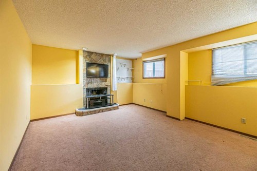 64 Castledale Crescent Ne, Calgary, AB - Indoor With Fireplace