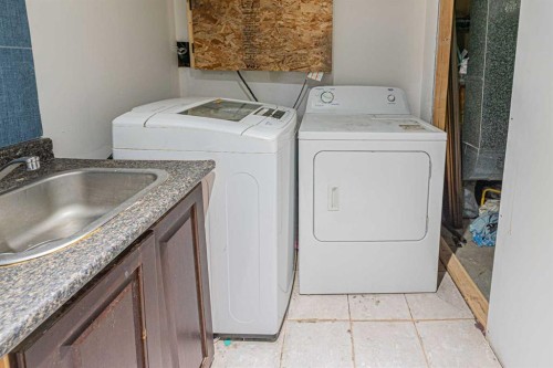 64 Castledale Crescent Ne, Calgary, AB - Indoor Photo Showing Laundry Room