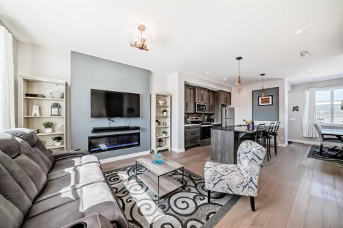 1016 Lanark Boulevard Se, Airdrie, AB - Indoor Photo Showing Living Room With Fireplace
