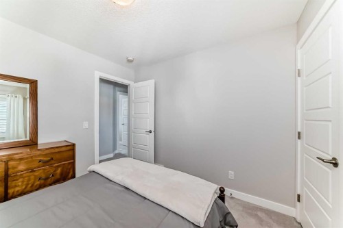 1016 Lanark Boulevard Se, Airdrie, AB - Indoor Photo Showing Bedroom