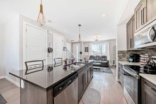 1016 Lanark Boulevard Se, Airdrie, AB - Indoor Photo Showing Kitchen With Double Sink With Upgraded Kitchen