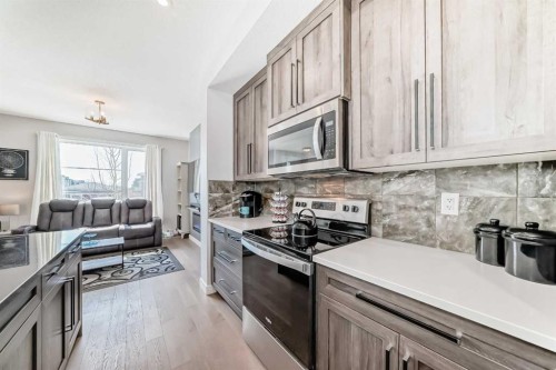 1016 Lanark Boulevard Se, Airdrie, AB - Indoor Photo Showing Kitchen With Stainless Steel Kitchen With Upgraded Kitchen