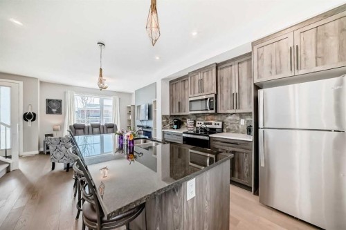1016 Lanark Boulevard Se, Airdrie, AB - Indoor Photo Showing Kitchen With Stainless Steel Kitchen With Upgraded Kitchen