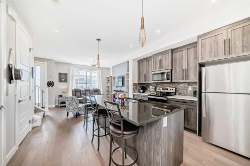 1016 Lanark Boulevard Se, Airdrie, AB - Indoor Photo Showing Kitchen With Stainless Steel Kitchen With Upgraded Kitchen