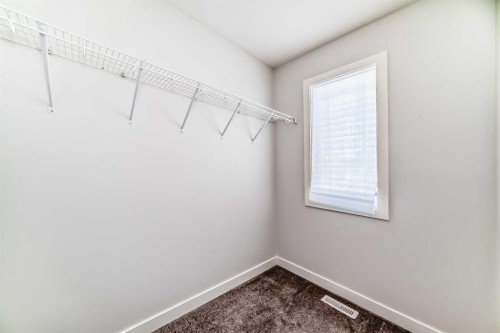121 Ambleside Heath Nw, Calgary, AB - Indoor With Storage