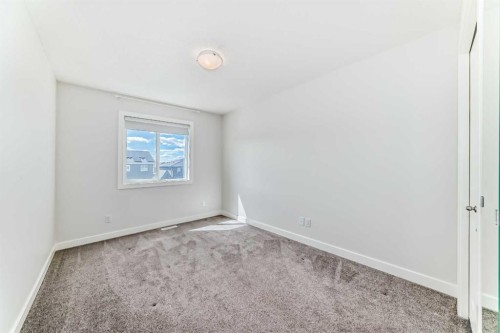 121 Ambleside Heath Nw, Calgary, AB - Indoor Photo Showing Other Room