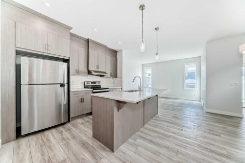 121 Ambleside Heath Nw, Calgary, AB - Indoor Photo Showing Kitchen With Upgraded Kitchen