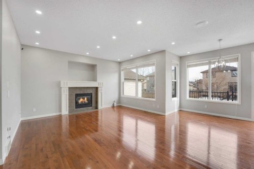 116 West Creek Glen, Chestermere, AB - Indoor Photo Showing Other Room With Fireplace