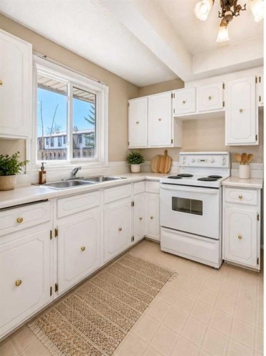 45-2727 Rundleson Road Ne, Calgary, AB - Indoor Photo Showing Kitchen With Double Sink