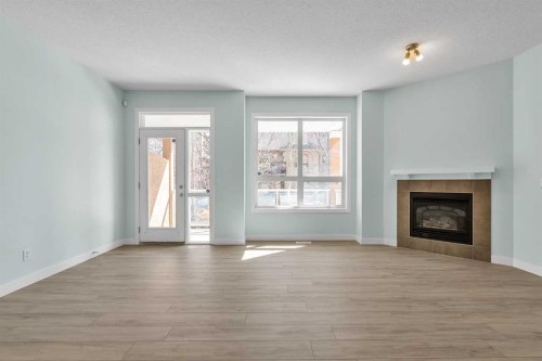 34 Royal Manor Nw, Calgary, AB - Indoor Photo Showing Living Room With Fireplace