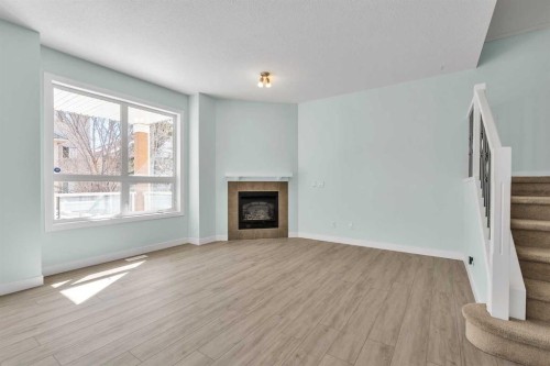 34 Royal Manor Nw, Calgary, AB - Indoor Photo Showing Living Room With Fireplace