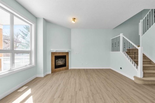 34 Royal Manor Nw, Calgary, AB - Indoor With Fireplace