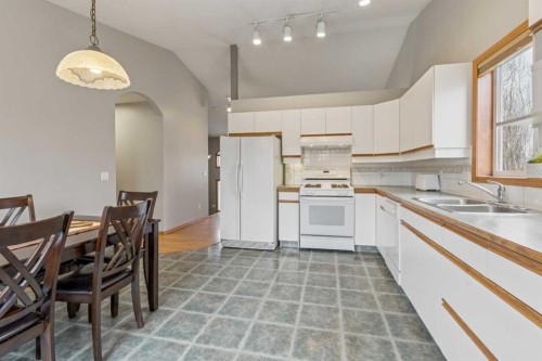 10 Bow Ridge Lane, Cochrane, AB - Indoor Photo Showing Kitchen With Double Sink