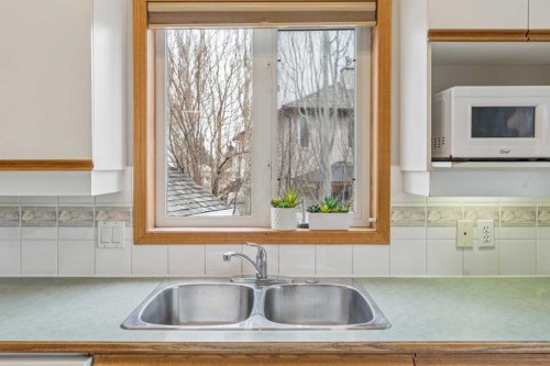 10 Bow Ridge Lane, Cochrane, AB - Indoor Photo Showing Kitchen With Double Sink