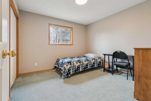 10 Bow Ridge Lane, Cochrane, AB - Indoor Photo Showing Bedroom
