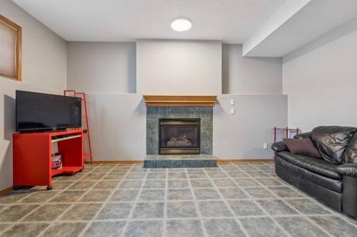 10 Bow Ridge Lane, Cochrane, AB - Indoor Photo Showing Other Room With Fireplace