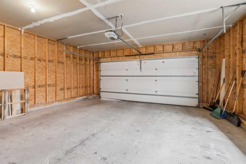 10 Bow Ridge Lane, Cochrane, AB - Indoor Photo Showing Garage