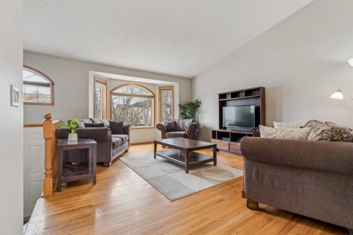 10 Bow Ridge Lane, Cochrane, AB - Indoor Photo Showing Living Room