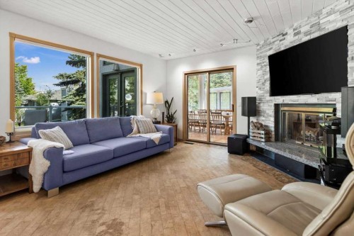 75 Hawkside Close Nw, Calgary, AB - Indoor Photo Showing Living Room With Fireplace
