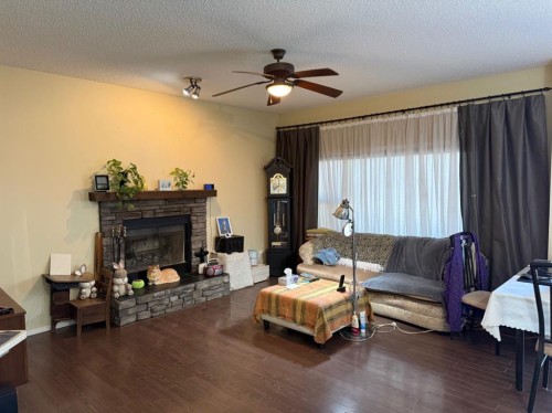 13 Tuscany Ridge Mews Nw, Calgary, AB - Indoor Photo Showing Living Room With Fireplace
