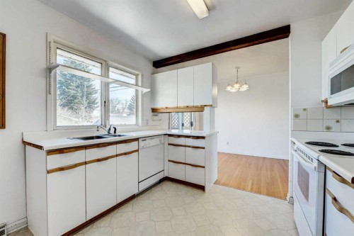 48 Westover Drive Sw, Calgary, AB - Indoor Photo Showing Kitchen With Double Sink