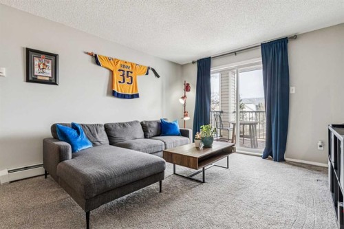 2211-2371 Eversyde Avenue Sw, Calgary, AB - Indoor Photo Showing Living Room