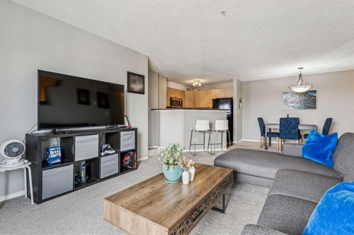 2211-2371 Eversyde Avenue Sw, Calgary, AB - Indoor Photo Showing Living Room