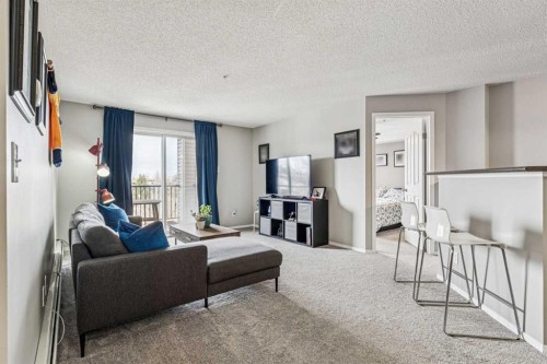 2211-2371 Eversyde Avenue Sw, Calgary, AB - Indoor Photo Showing Living Room