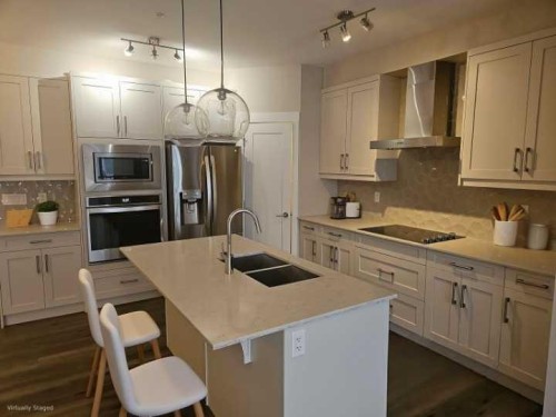 217-30 Walgrove Se, Calgary, AB - Indoor Photo Showing Kitchen With Stainless Steel Kitchen With Double Sink With Upgraded Kitchen