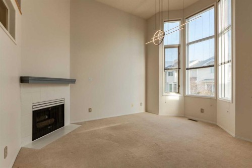 318 Hawkstone Manor Nw, Calgary, AB - Indoor With Fireplace