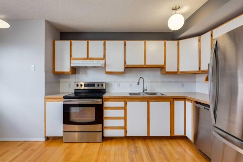 318 Hawkstone Manor Nw, Calgary, AB - Indoor Photo Showing Kitchen With Double Sink