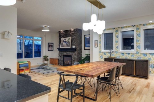 29 Aspenshire Crescent Sw, Calgary, AB - Indoor Photo Showing Dining Room With Fireplace