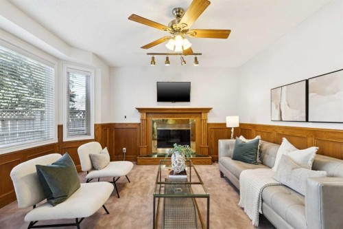 1442 Sunwood Road Se, Calgary, AB - Indoor Photo Showing Living Room With Fireplace