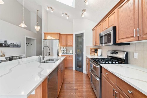 611 Cavendish Beach Bay, Chestermere, AB - Indoor Photo Showing Kitchen With Double Sink With Upgraded Kitchen