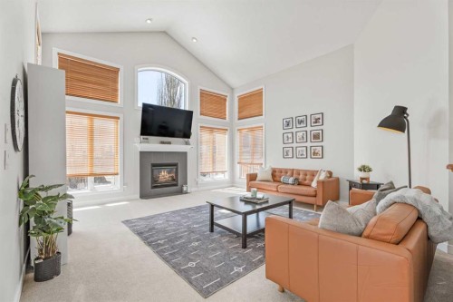 611 Cavendish Beach Bay, Chestermere, AB - Indoor Photo Showing Living Room With Fireplace
